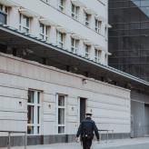 Police officer walking in empty street